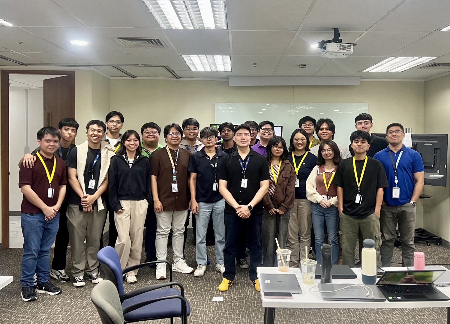 The intern cohort with their supervisor in a meeting room